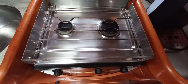 Roxanne Yacht Photos Pics Stainless steel two-burner stove on 1990 Beneteau Oceanis Clipper 500 yacht.