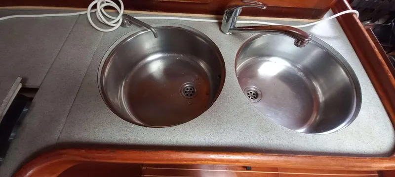 Roxanne Yacht Photos Pics Double stainless steel sink in 1990 Beneteau Oceanis Clipper 500 yacht kitchen.