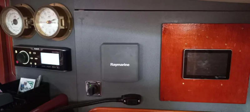 Roxanne Yacht Photos Pics Control panel of a 1990 Beneteau Oceanis Clipper 500 sailboat with navigation instruments.