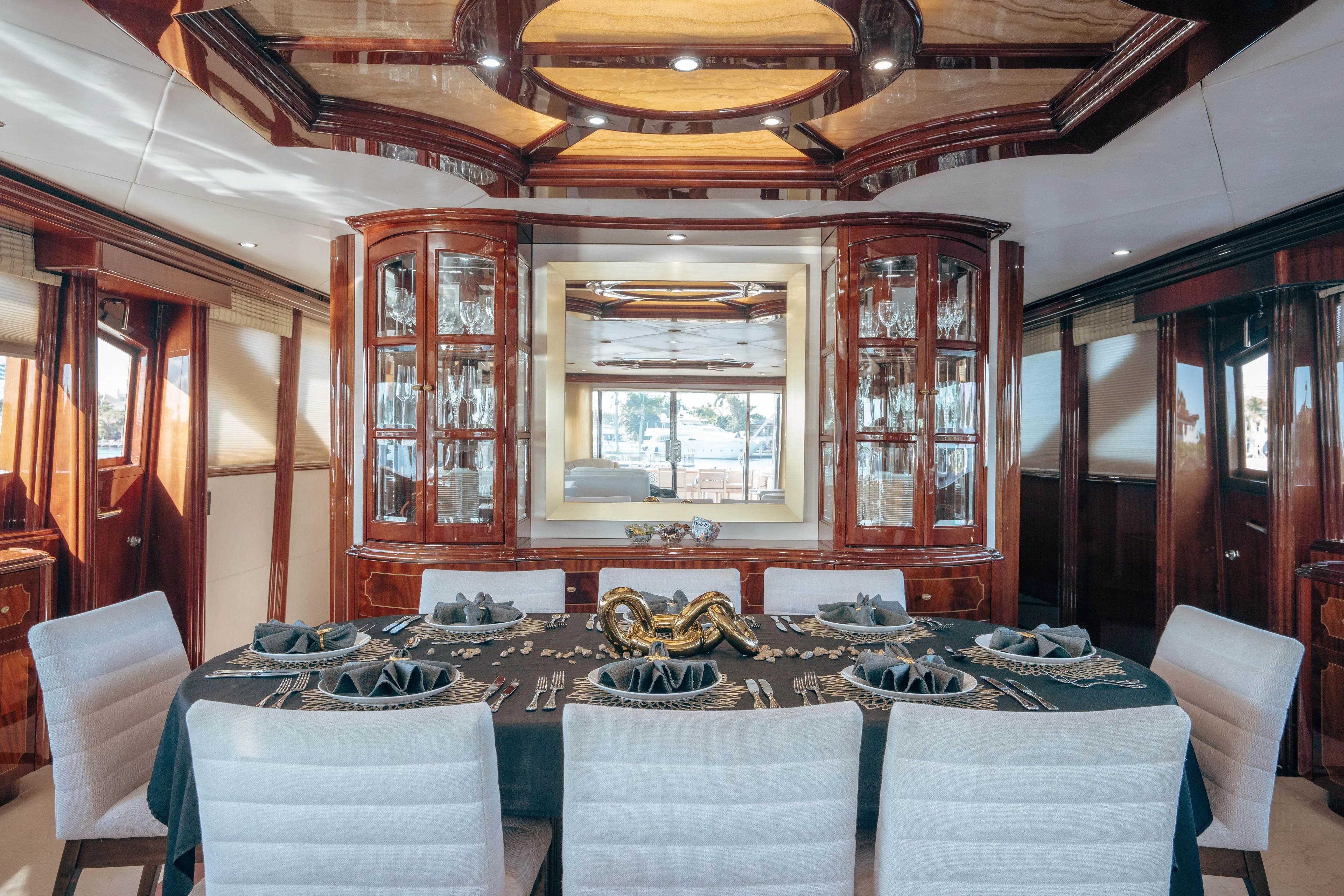 Lady Kristina Yacht Photos Pics Luxurious dining area on 2004 Lazzara LY106 yacht with elegant table setting.