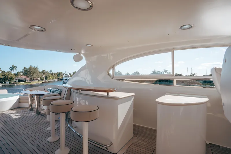 Lady Kristina Yacht Photos Pics Luxurious 2004 Lazzara LY106 yacht interior with elegant seating and scenic waterway view.