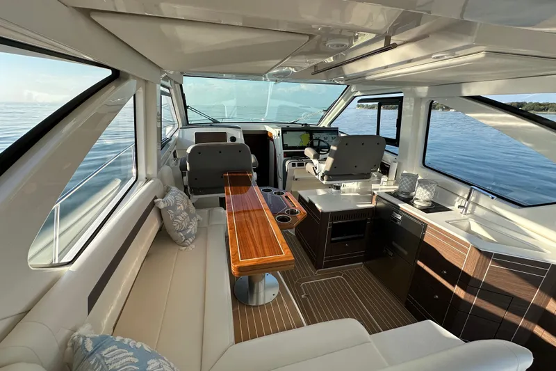  Yacht Photos Pics Luxurious interior of 2024 Pursuit OS 445 Offshore yacht with modern amenities and scenic ocean view.