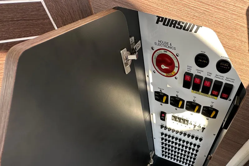  Yacht Photos Pics 2024 Pursuit OS 445 Offshore electrical panel with switches and controls.