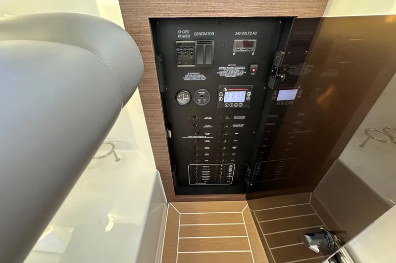  Yacht Photos Pics 2024 Pursuit OS 445 Offshore electrical panel with controls and gauges.