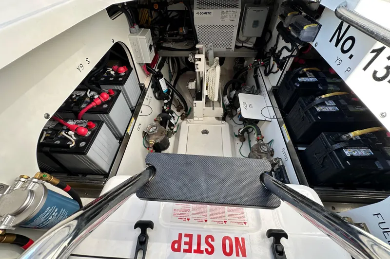  Yacht Photos Pics 2024 Pursuit OS 445 Offshore engine compartment with batteries and equipment.
