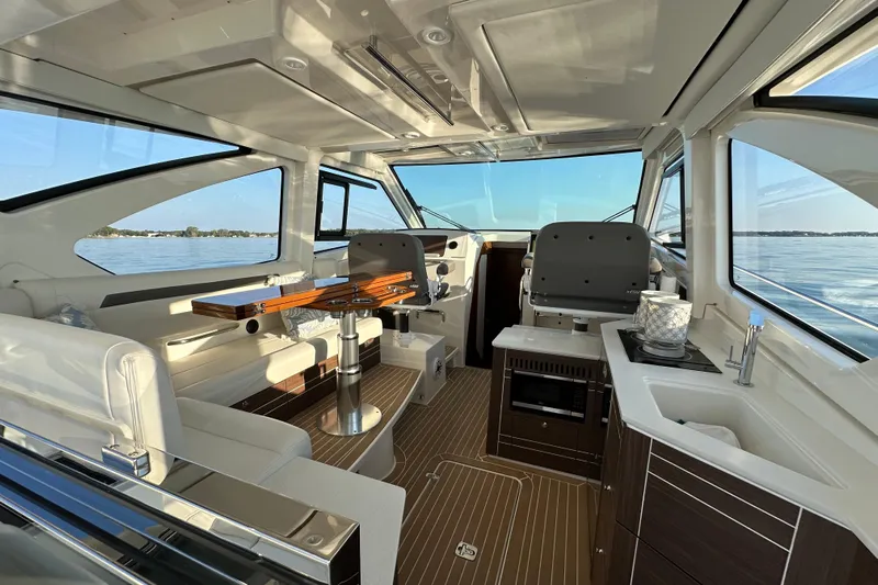  Yacht Photos Pics Luxurious interior of 2024 Pursuit OS 445 Offshore yacht with modern amenities and scenic views.