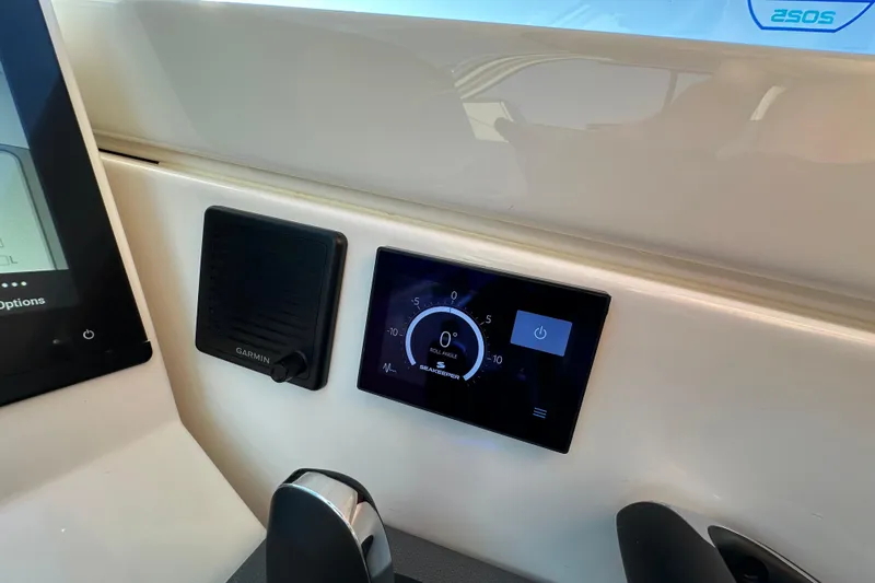  Yacht Photos Pics 2024 Pursuit OS 445 Offshore dashboard with Garmin display and control panel.