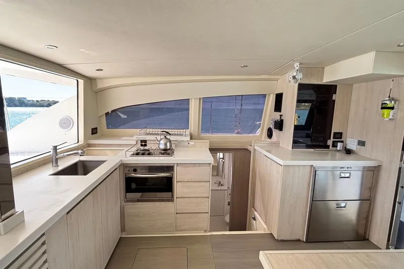  Yacht Photos Pics Modern kitchen interior on a 2016 Leopard 40 yacht, featuring sleek appliances and ample counter space.