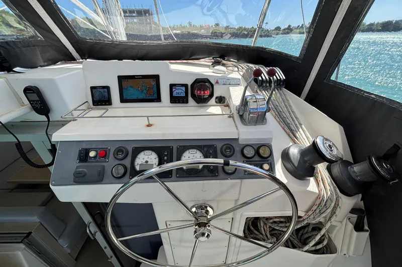  Yacht Photos Pics Helm of 2016 Leopard 40 catamaran with navigation instruments and steering wheel.
