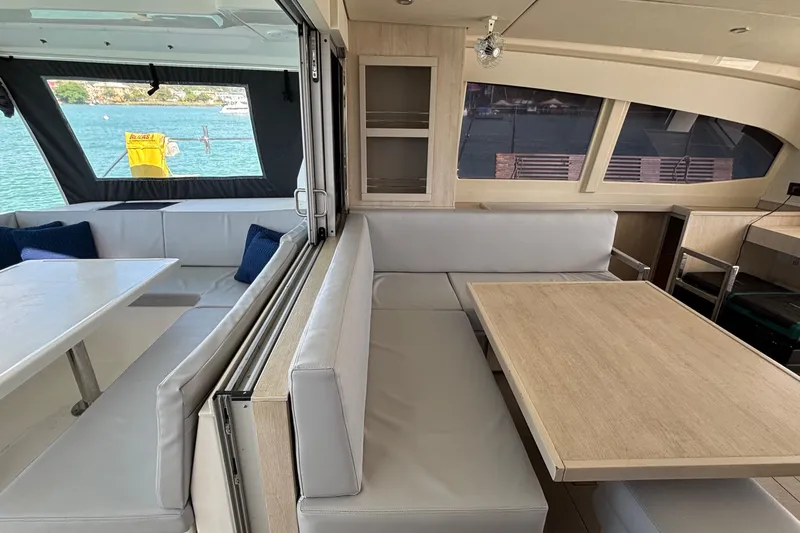  Yacht Photos Pics Interior of 2016 Leopard 40 catamaran with modern seating and dining area.