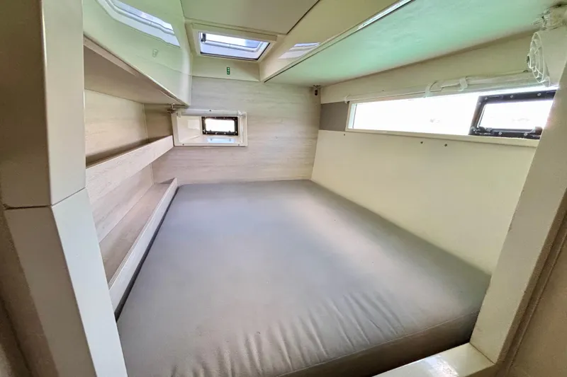  Yacht Photos Pics Cabin interior of 2016 Leopard 40 catamaran with bed and windows.