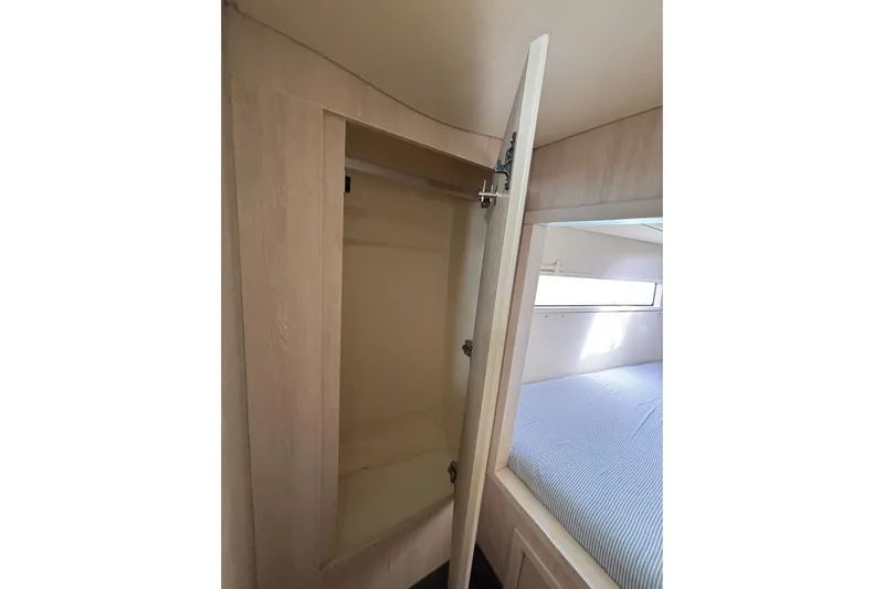  Yacht Photos Pics Interior of 2016 Leopard 40 yacht showing open closet and bed area.