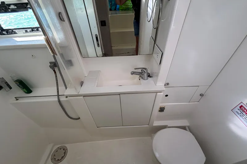  Yacht Photos Pics Bathroom interior of a 2016 Leopard 40 yacht, featuring sink, toilet, and shower.