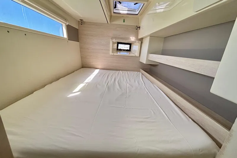  Yacht Photos Pics Interior cabin of a 2016 Leopard 40 catamaran with a bed and window.