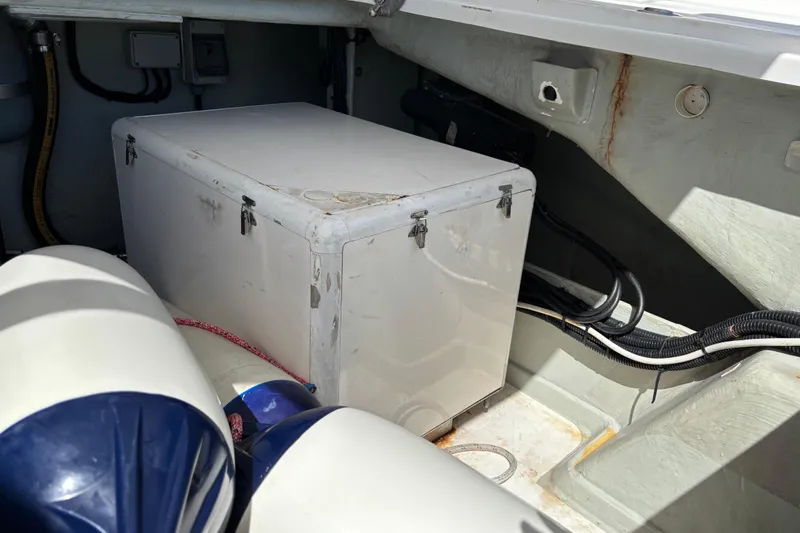  Yacht Photos Pics Storage compartment in a 2016 Leopard 40 boat, featuring a secured white box.