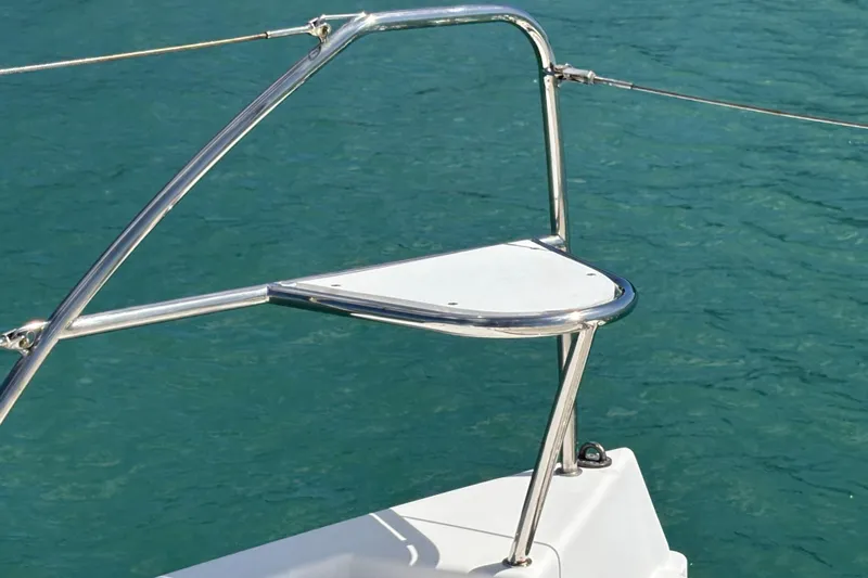  Yacht Photos Pics Stainless steel bow pulpit on 2016 Leopard 40 catamaran, over clear blue water.