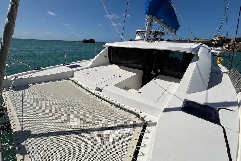  Yacht Photos Pics 2016 Leopard 40 catamaran on calm sea, featuring spacious deck and netting.