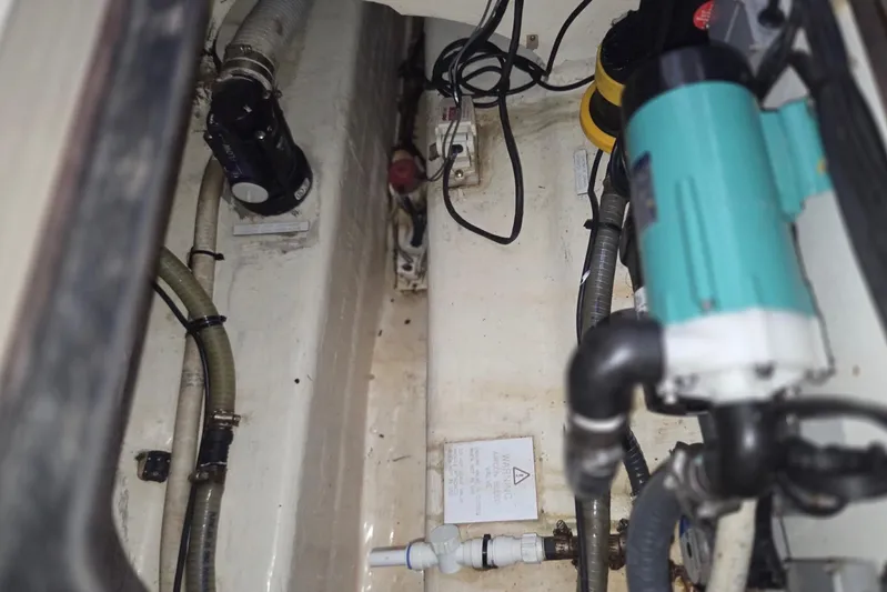  Yacht Photos Pics Engine compartment of a 2016 Leopard 40 catamaran, showing hoses and mechanical components.