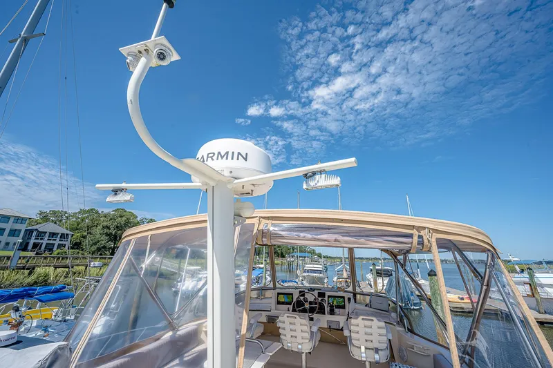 Coastal Fogg Yacht Photos Pics 2006 Mainship 34 Trawler with Garmin equipment, docked under a clear blue sky.