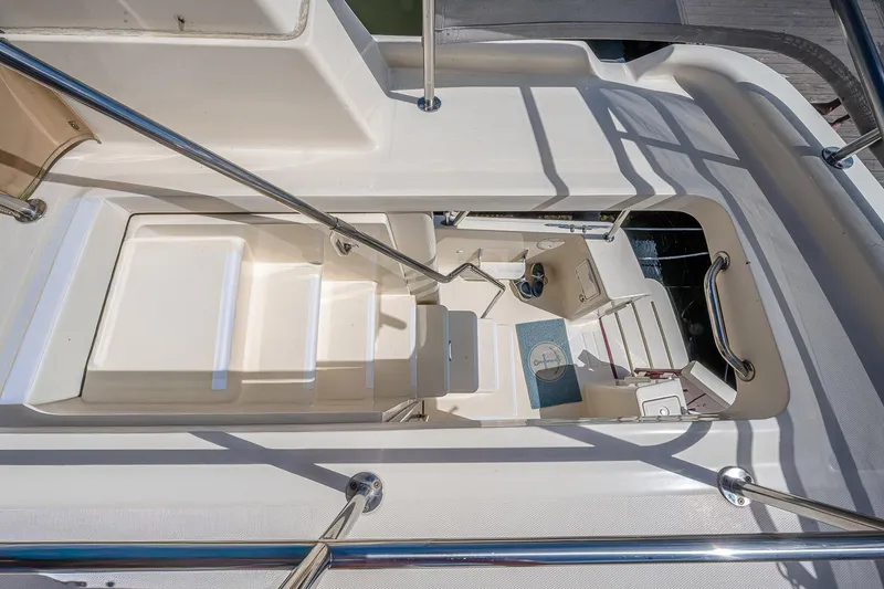 Coastal Fogg Yacht Photos Pics 2006 Mainship 34 Trawler cockpit view with seating and railings.