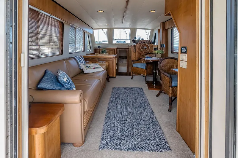 Coastal Fogg Yacht Photos Pics Interior of 2006 Mainship 34 Trawler with cozy seating and nautical decor.