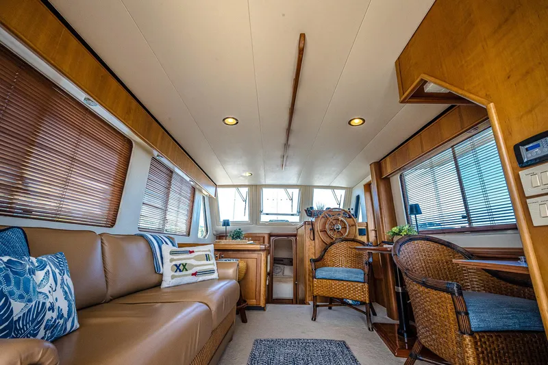 Coastal Fogg Yacht Photos Pics Interior of 2006 Mainship 34 Trawler with cozy seating and nautical decor.