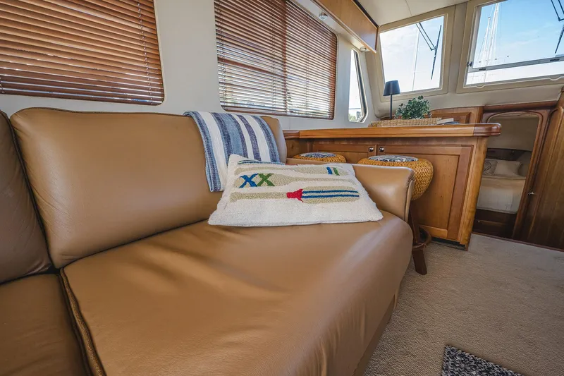 Coastal Fogg Yacht Photos Pics Interior of 2006 Mainship 34 Trawler with leather seating and nautical decor.