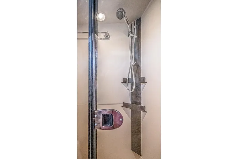 Coastal Fogg Yacht Photos Pics Shower area in 2006 Mainship 34 Trawler, featuring modern fixtures and sleek design.