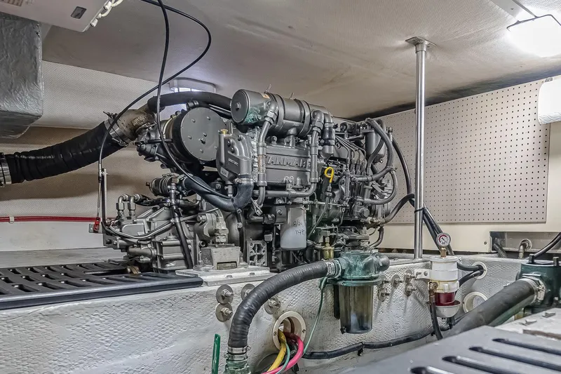 Coastal Fogg Yacht Photos Pics Engine room of a 2006 Mainship 34 Trawler, showcasing detailed mechanical components.