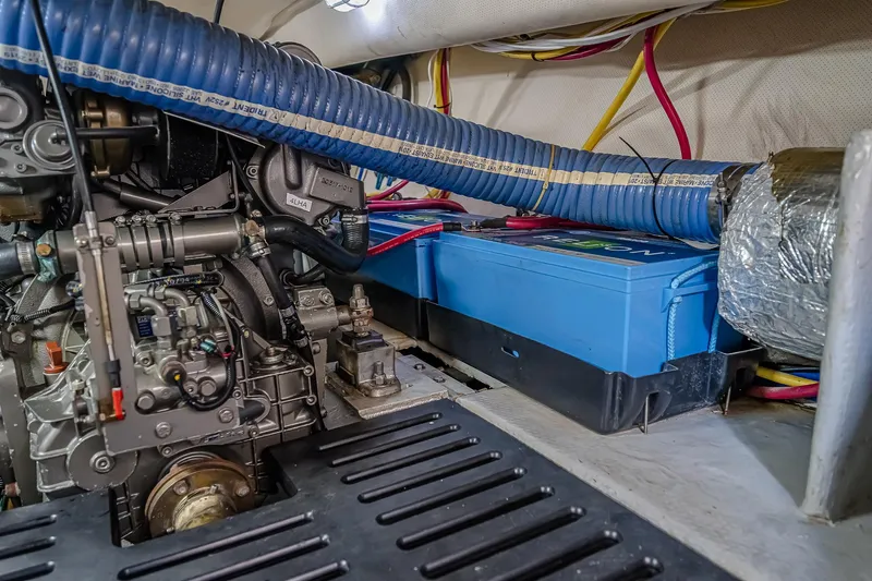 Coastal Fogg Yacht Photos Pics Engine room of 2006 Mainship 34 Trawler with visible battery and wiring.
