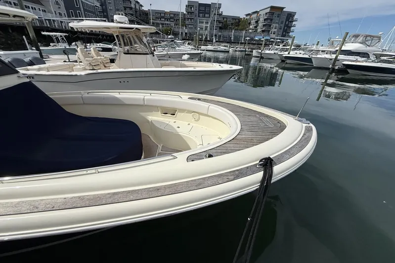  Yacht Photos Pics 2019 Chris-Craft Catalina 30 docked in a marina, showcasing sleek design and luxury features.
