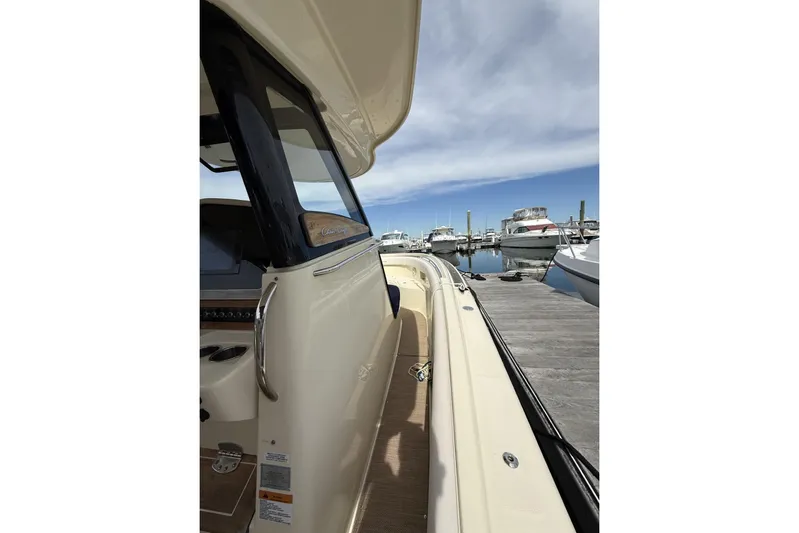  Yacht Photos Pics 2019 Chris-Craft Catalina 30 docked at marina under clear blue sky.