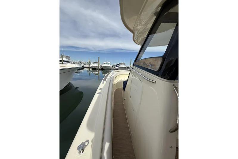  Yacht Photos Pics 2019 Chris-Craft Catalina 30 docked at marina under clear blue sky.