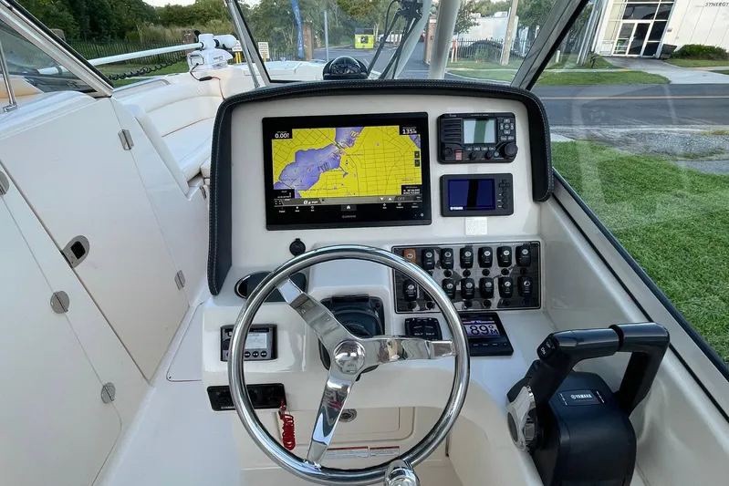  Yacht Photos Pics 2021 Grady-White Freedom 275 boat dashboard with navigation and control systems.