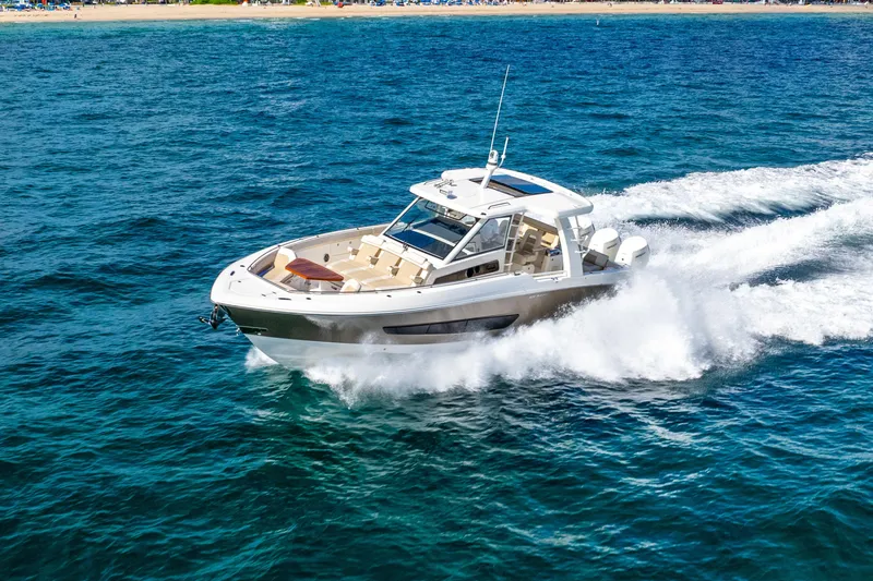 Gugui Yacht Photos Pics 2024 Boston Whaler 420 Outrage cruising on open water, showcasing sleek design and performance.