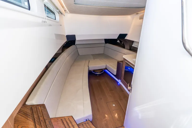 Gugui Yacht Photos Pics Luxurious interior of 2024 Boston Whaler 420 Outrage with elegant seating and ambient lighting.