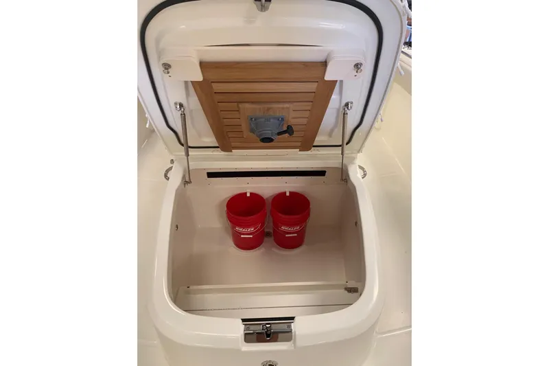  Yacht Photos Pics Open storage compartment on 2019 Boston Whaler 330 Outrage with red buckets inside.