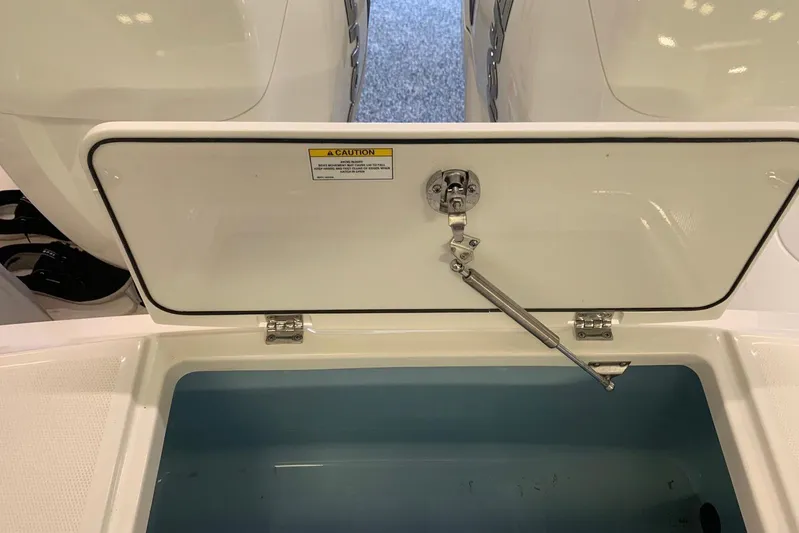  Yacht Photos Pics Open storage compartment on a 2019 Boston Whaler 330 Outrage boat.