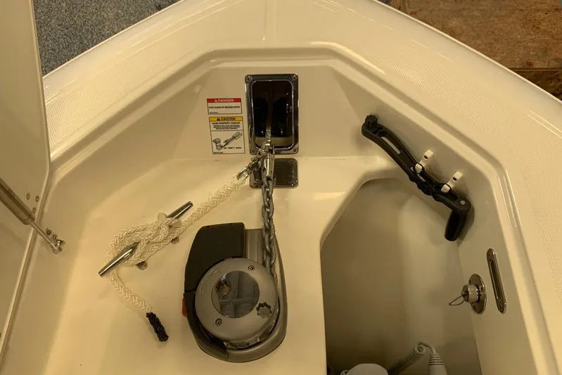  Yacht Photos Pics 2019 Boston Whaler 330 Outrage anchor compartment with chain and rope setup.
