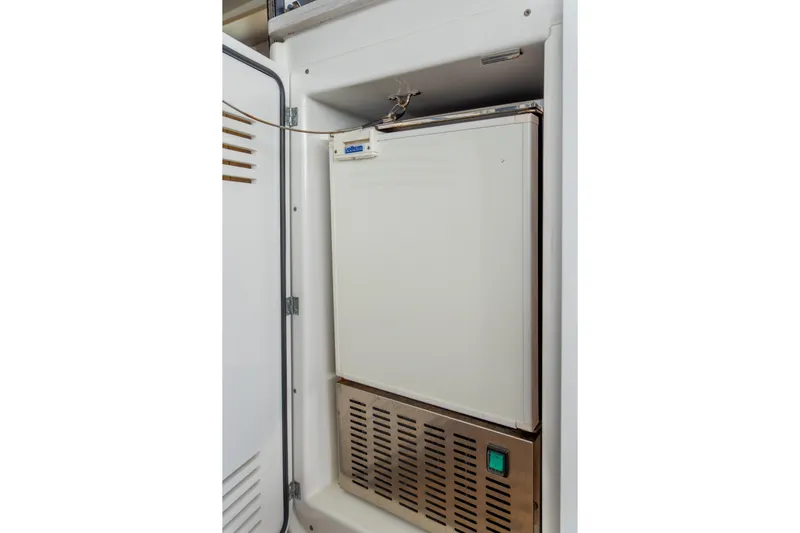 Dakiti Yacht Photos Pics Built-in refrigerator on 2023 Lagoon 46 yacht, featuring a compact design.