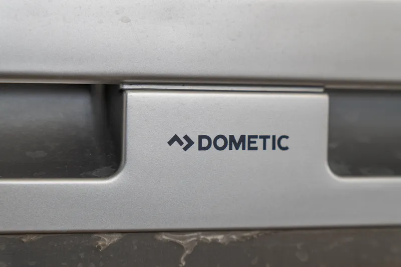 Dakiti Yacht Photos Pics Close-up of Dometic logo on a 2023 Lagoon 46 yacht appliance.