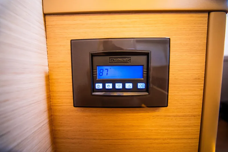 Dakiti Yacht Photos Pics Digital control panel on 2023 Lagoon 46 yacht, displaying temperature settings.