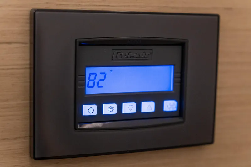 Dakiti Yacht Photos Pics Digital thermostat display on 2023 Lagoon 46 yacht, showing 82 degrees Fahrenheit.
