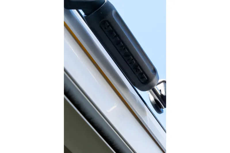 Dakiti Yacht Photos Pics Close-up of a 2023 Lagoon 46 boat detail against a clear blue sky.