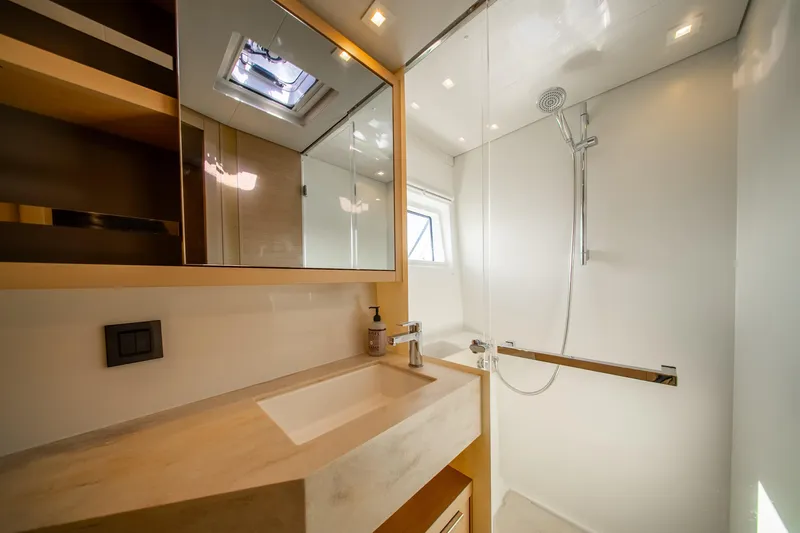 Dakiti Yacht Photos Pics Modern bathroom in 2023 Lagoon 46 yacht with sleek shower and vanity.