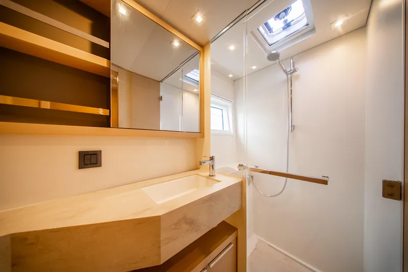Dakiti Yacht Photos Pics Luxurious bathroom in 2023 Lagoon 46 yacht with modern fixtures and elegant design.