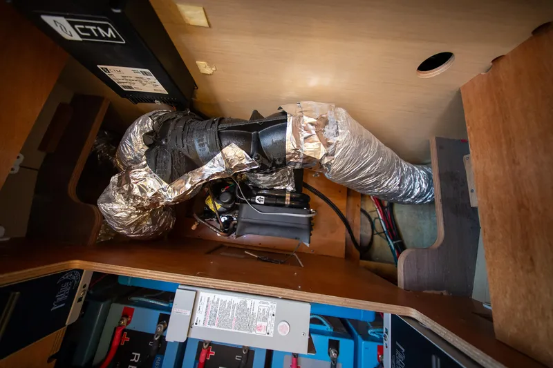 Dakiti Yacht Photos Pics Interior view of 2023 Lagoon 46 yacht showing electrical and ductwork components.