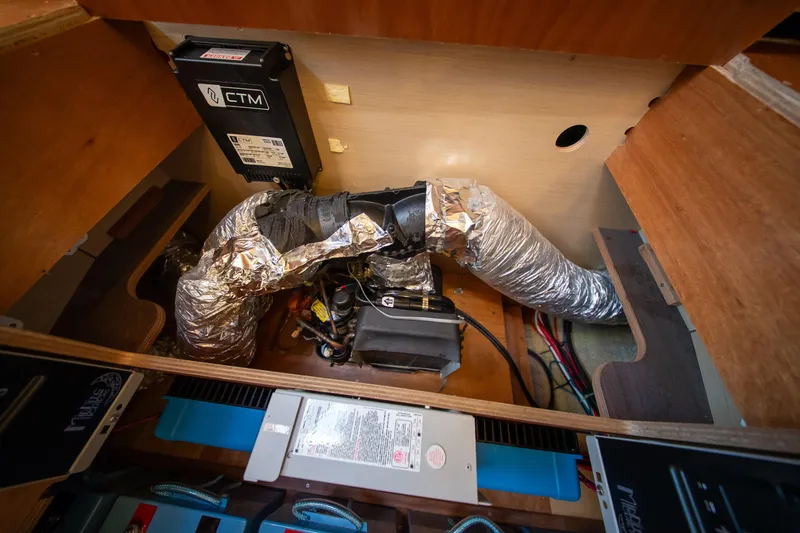 Dakiti Yacht Photos Pics 2023 Lagoon 46 yacht interior showing air conditioning system components and wiring.