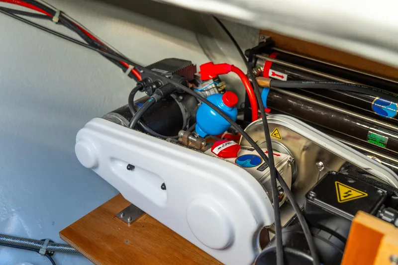 Dakiti Yacht Photos Pics Engine compartment of 2023 Lagoon 46 yacht, showcasing mechanical components and wiring.