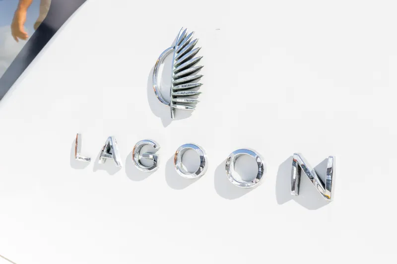 Dakiti Yacht Photos Pics 2023 Lagoon 46 yacht logo with sleek chrome lettering and emblem.